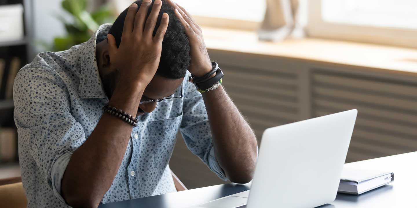 Photo of Upset man on his desk | 7 Reasons Why You Should Consider a Ready – Made Business in Kenya