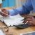 Gentleman of African descent looking at a document while on his calculator | KRA Pin registration services in Kenya | Business registration services in Nairobi